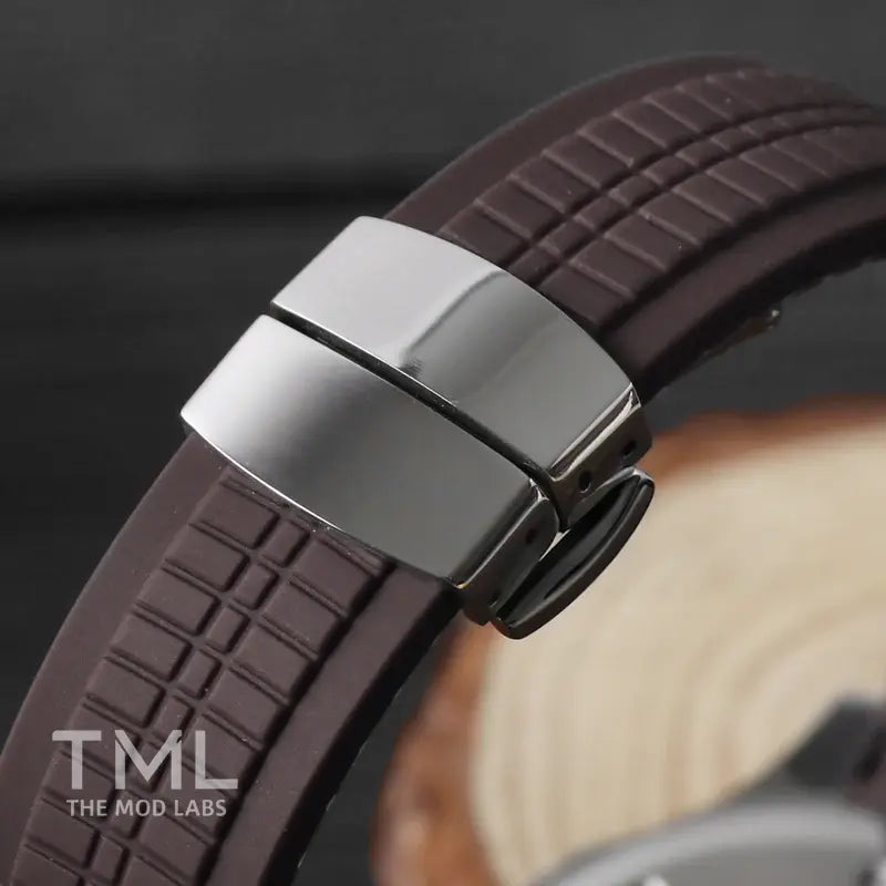 Close-up of a brown watch strap with a silver buckle on a blurred background the mod labs seiko mod watch