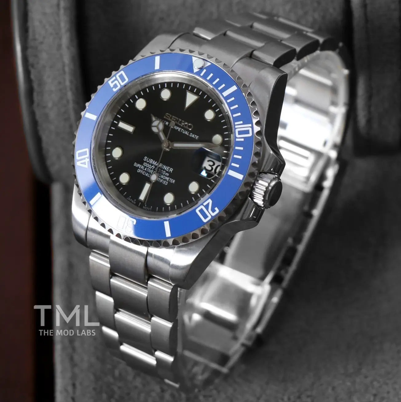 seiko mod watch blue and black on a dark background the mod labs