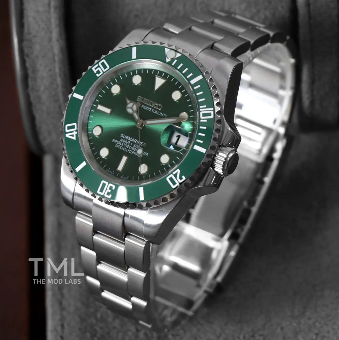 seiko mod watch hulk with green bezel and face on a dark background